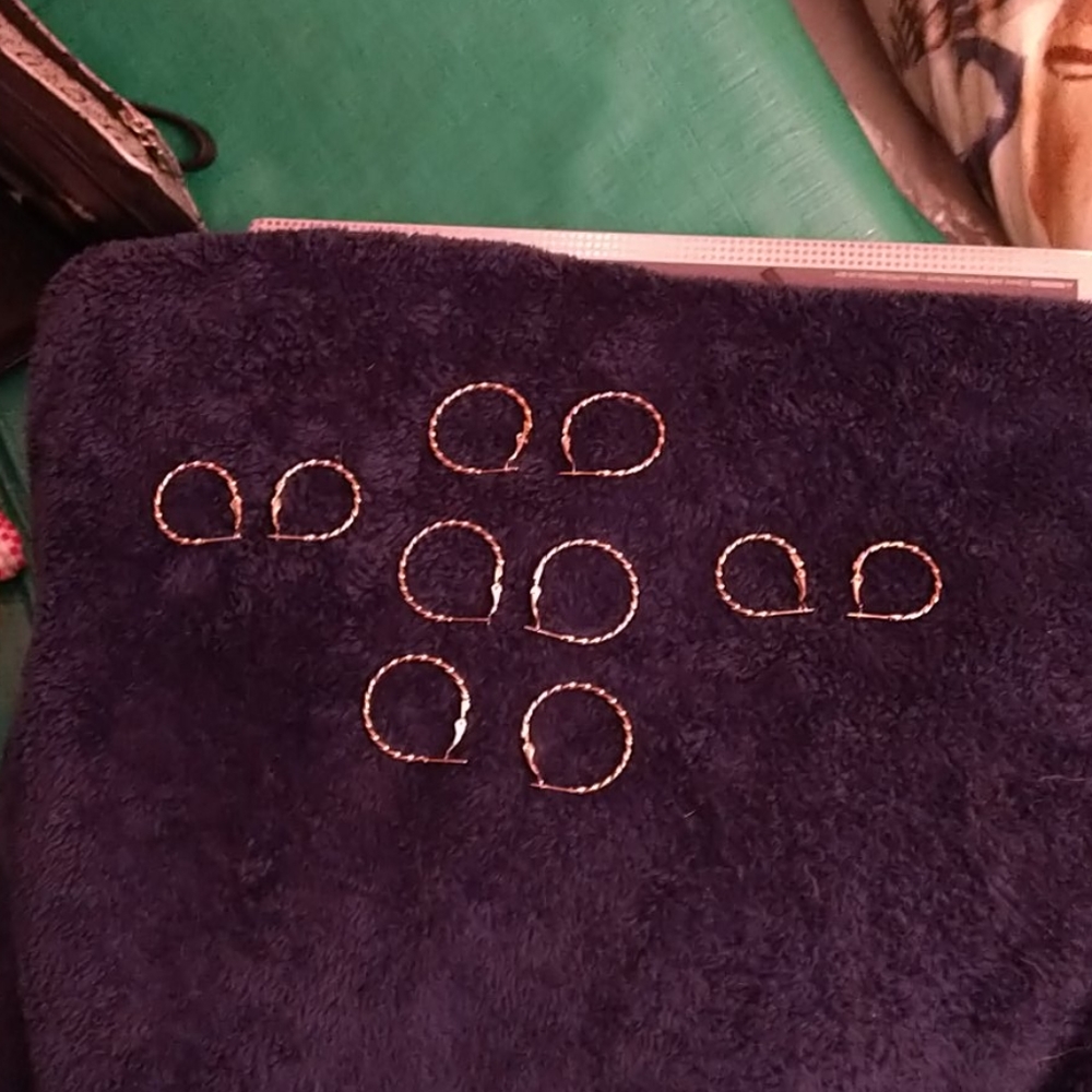 G P. Twisted hoops earrings